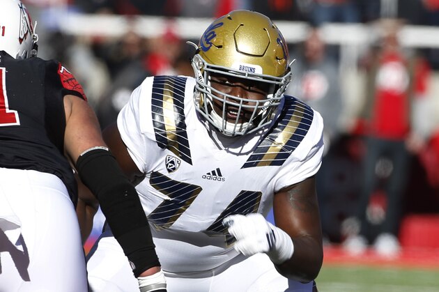 SALT LAKE CITY, UT - NOVEMBER 21:  Caleb Benenoch #74 of the UCLA Bruins prepare to block Kylie Fitts #11 of the Utah Utes during the first half of a college football game at Rice Eccles Stadium on November 21, 2015 in Salt Lake City, Utah. (Photo by George Frey/Getty Images)