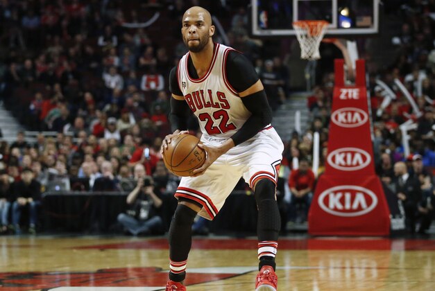 Mar 21, 2016; Chicago, IL, USA; Chicago Bulls forward Taj Gibson (22) looks to pass the ball against the Sacramento Kings during the first half at United Center. Mandatory Credit: Kamil Krzaczynski-USA TODAY Sports