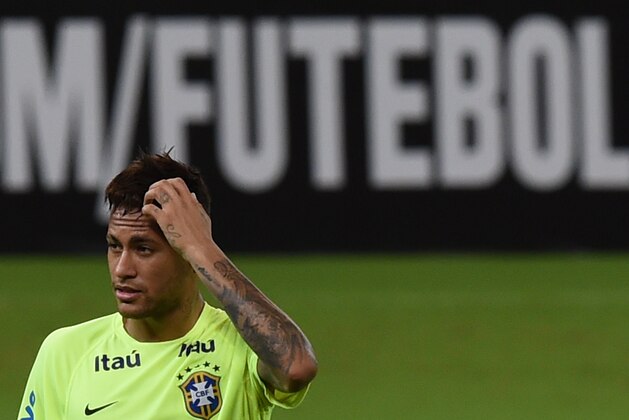 Brazilian national football player Neymar takes part in a training session at Arena Pernambuco stadium in Recife Brazil on March 24, 2016. Brazil will face Uruguay on March 25 and Paraguay March 29 in FIFA World Cup Russia 2018 South American qualifier matches. AFP PHOTO / VANDERLEI ALMEIDA / AFP / VANDERLEI ALMEIDA (Photo credit should read VANDERLEI ALMEIDA/AFP/Getty Images) Brazilian national football player Neymar takes part in a training session at Arena Pernambuco stadium in Recife Brazil on March 24, 2016. Brazil will face Uruguay on March 25 and Paraguay March 29 in FIFA World Cup Russia 2018 South American qualifier matches. AFP PHOTO / VANDERLEI ALMEIDA / AFP / VANDERLEI ALMEIDA (Photo credit should read VANDERLEI ALMEIDA/AFP/Getty Images)