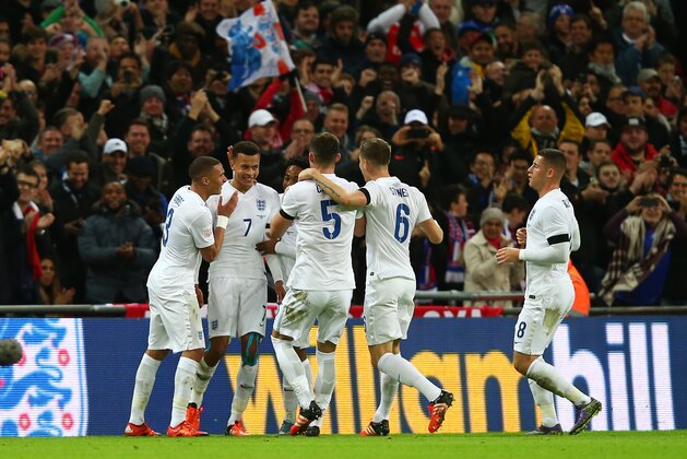 LONDON, ENGLAND - NOVEMBER 17: Dele Alli (2nd L) of England celebrates scoring his team's first goal with his team mates during the International Friendly match between England and France at Wembley Stadium on November 17, 2015 in London, England.  (Photo by Clive Rose/Getty Images)