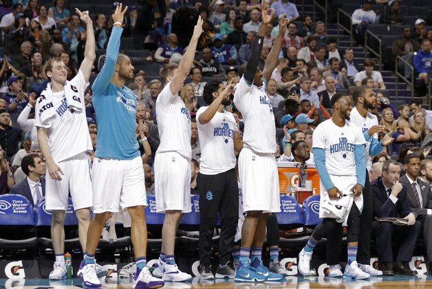Charlotte Hornets players celebrate a teammate's 3-point basket against the Phoenix Suns in the second half of an NBA basketball game in Charlotte, N.C., Tuesday, March 1, 2016. The Hornets won 126-92. (AP Photo/Chuck Burton)