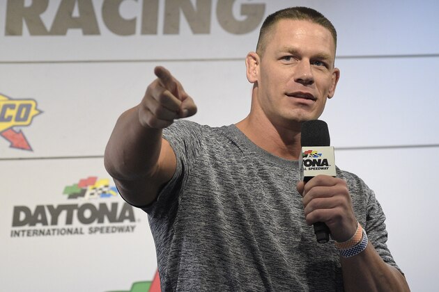 Professional wrestler John Cena answers question from the media during a news conference before the NASCAR Daytona 500 Sprint Cup Series auto race at Daytona International Speedway in Daytona Beach, Fla., Sunday, Feb. 21, 2016. (AP Photo/Phelan M. Ebenhack)