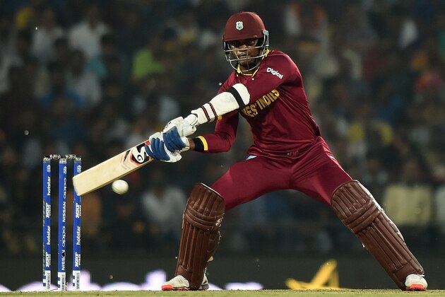 West Indies batsman Marlon Samuels plays a shot during the World T20 cricket tournament match between South Africa and West Indies at The Vidarbha Cricket Association Stadium in Nagpur on March 25, 2016. / AFP / PUNIT PARANJPE        (Photo credit should read PUNIT PARANJPE/AFP/Getty Images)