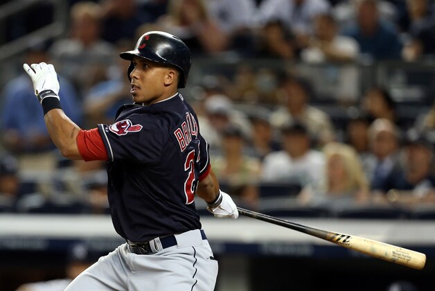 Aug 20, 2015; Bronx, NY, USA; Cleveland Indians designated hitter Michael Brantley (23) hits an RBI single against the New York Yankees during the third inning at Yankee Stadium. Mandatory Credit: Adam Hunger-USA TODAY Sports
