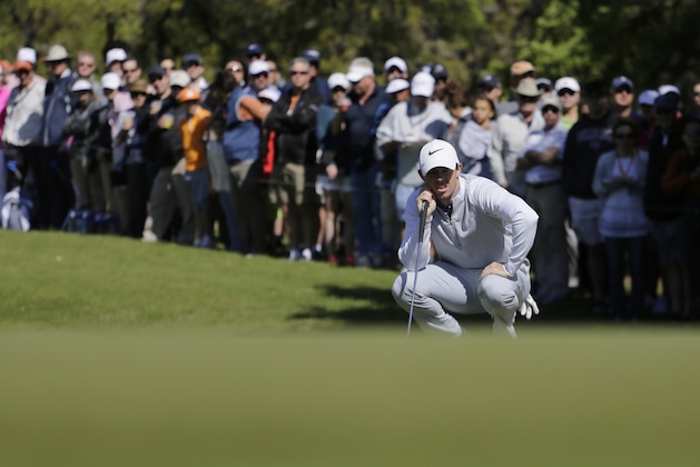 Rory McIlroy of Northern Ireland lines up his putt on the first green during round-robin play against  Kevin Na at the Dell Match Play Championship golf tournament at Austin County Club, Friday, March 25, 2016, in Austin, Texas. (AP Photo/Eric Gay)
