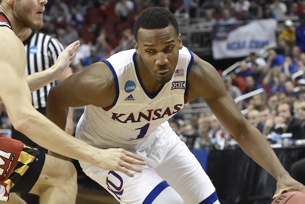 Kansas guard Wayne Selden Jr. (1) drives on Maryland forward Jake Layman during the second half of an NCAA college basketball game in the regional semifinals of the men's NCAA Tournament, in Louisville, Ky., Thursday, March 24, 2016. Kansas won 79-63. (AP Photo/John Flavell)
