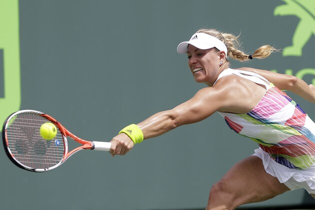 Angelique Kerber, of Germany, returns to Barbora Strycova during a match at the Miami Open tennis tournament in Key Biscayne, Fla., Friday, March 25, 2016. (AP Photo/Alan Diaz)