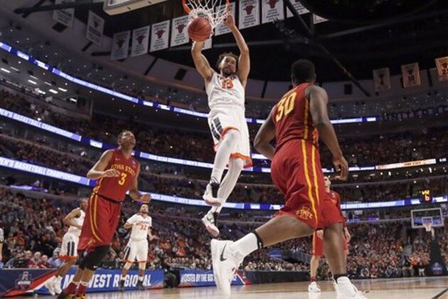 Virginia's Anthony Gill (13) dunks during the first half of a college basketball game against Iowa State in the regional semifinals of the NCAA Tournament, Friday, March 25, 2016, in Chicago. (AP Photo/Charles Rex Arbogast)