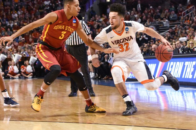 Mar 25, 2016; Chicago, IL, USA; Virginia Cavaliers guard London Perrantes (32) drives to the basket against Iowa State Cyclones guard Hallice Cooke (3) during the first half in a semifinal game in the Midwest regional of the NCAA Tournament at United Center. Mandatory Credit: David Banks-USA TODAY Sports
