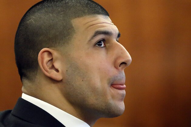 Former New England Patriots NFL football player Aaron Hernandez is seated during his murder trial, Thursday, April 2, 2015, in Fall River, Mass. Hernandez is charged with killing Odin Lloyd in June 2013. (AP Photo/Steven Senne, Pool)