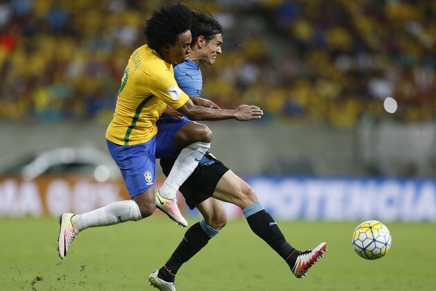 Uruguay's Edinson Cavani, right, fights for a ball with Brazil's Willian during a 2018 World Cup qualifying soccer match in Recife, Brazil, Friday, March 25, 2016. The match ended in a 2-2 tie. (AP Photo/Andre Penner) Uruguay's Edinson Cavani, right, fights for a ball with Brazil's Willian during a 2018 World Cup qualifying soccer match in Recife, Brazil, Friday, March 25, 2016. The match ended in a 2-2 tie. (AP Photo/Andre Penner)