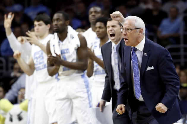 North Carolina coach Roy Williams and players react during the second half of the team's college basketball game against Indiana in the regional semifinals of the men's NCAA Tournament, early Saturday, March 26, 2016, in Philadelphia. (AP Photo/Matt Rourke)