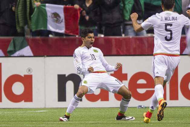 VANCOUVER, BC - MARCH 25:  Jesus Manuel Corona #10 of Mexico celebrates with Jesus Molina #5 after scoring a goal against Canada during FIFA 2018 World Cup Qualifier soccer action at BC Place on March 25, 2016 in Vancouver, Canada. (Photo by Rich Lam/Getty Images)