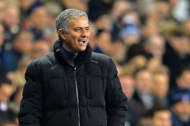 Chelsea's Portuguese manager Jose Mourinho laughs as a decision goes against his team during the English Premier League football match between Tottenham Hotspur and Chelsea at White Hart Lane in London on January 1, 2015. Tottenham won the game 5-3. AFP PHOTO / GLYN KIRK

== RESTRICTED TO EDITORIAL USE. NO USE WITH UNAUTHORIZED AUDIO, VIDEO, DATA, FIXTURE LISTS, CLUB/LEAGUE LOGOS OR LIVE SERVICES. ONLINE IN-MATCH USE LIMITED TO 45 IMAGES, NO VIDEO EMULATION. NO USE IN BETTING, GAMES OR SINGLE CLUB/LEAGUE/PLAYER PUBLICATIONS. ==        (Photo credit should read GLYN KIRK/AFP/Getty Images)