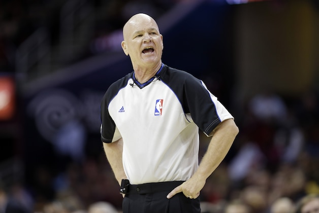 Referee Joe Crawford barks at the Indiana Pacers bench during a preseason NBA basketball game against the Cleveland Cavaliers Saturday, Oct. 19, 2013, in Cleveland. (AP Photo/Mark Duncan)