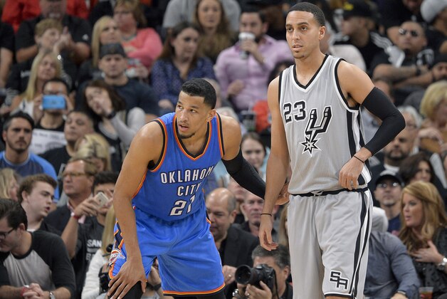 San Antonio Spurs guard Kevin Martin (23) and Oklahoma City Thunder guard Andre Roberson wait for an inbound pass during the first half of an NBA basketball game, Saturday, March 12, 2016, in San Antonio. San Antonio won 93-85. (AP Photo/Darren Abate)