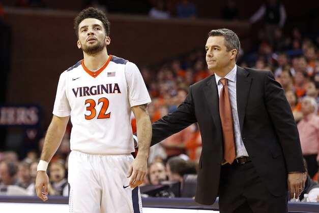 Jan 19, 2016; Charlottesville, VA, USA; Virginia Cavaliers head coach Tony Bennett encourages Cavaliers guard London Perrantes (32) after missing two free throws against the Clemson Tigers in the second half at John Paul Jones Arena. The Cavaliers won 69-62. Mandatory Credit: Geoff Burke-USA TODAY Sports