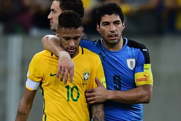 Brazil's Neymar (L) and Uruguay's Luis Suarez leave the field at the end of their Russia 2018 FIFA World Cup South American Qualifiers' football match, in Recife, northeastern Brazil, on March 25, 2016. The match ended 2-2.   AFP PHOTO / CHRISTOPHE SIMON / AFP / CHRISTOPHE SIMON        (Photo credit should read CHRISTOPHE SIMON/AFP/Getty Images)