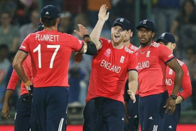 England's Ben Stokes, centre, celebrates after taking a catch to dismiss Sri Lanka's Chamara Kapugedera during their ICC World Twenty20 2016 cricket match at the Feroz Shah Kotla cricket stadium in New Delhi, India, Saturday, March 26, 2016. (AP Photo /Tsering Topgyal)