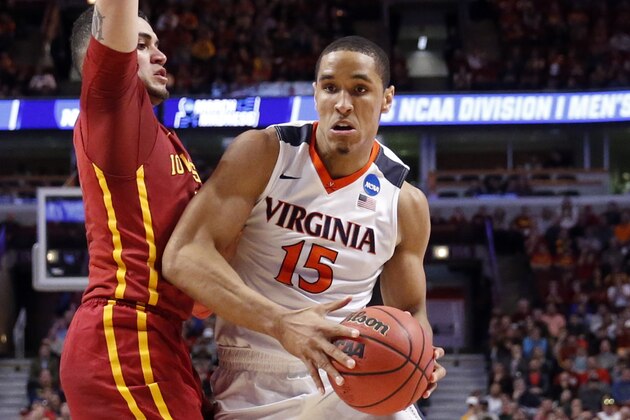 Virginia's Malcolm Brogdon (15) drives against Iowa State's Abdel Nader (2) during the first half of a college basketball game in the regional semifinals of the NCAA Tournament, Friday, March 25, 2016, in Chicago. (AP Photo/Charles Rex Arbogast)