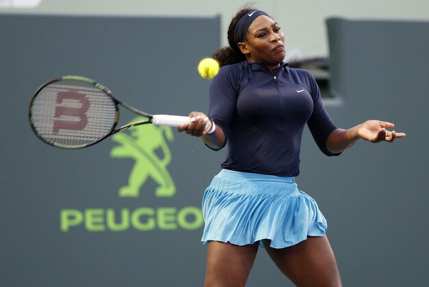 Mar 24, 2016; Key Biscayne, FL, USA; Serena Williams hits a forehand against Christina McHale (not pictured) on day three of the Miami Open at Crandon Park Tennis Center. Williams won 6-3, 5-7, 6-2. Mandatory Credit: Geoff Burke-USA TODAY Sports