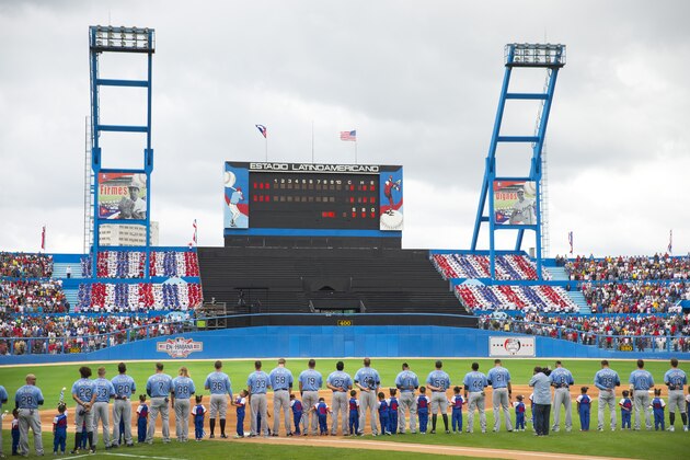 Members of the Tampa Bay Rays baseball team on the field during the playing of the nationals anthems before the start of an exhibition game against the Cuban National team at the Estadio Latinoamericano, Tuesday, March 22, 2016, in Havana, Cuba. President Barack Obama and Cuban President Raul Castro also attended the game.(AP Photo/Pablo Martinez Monsivais)