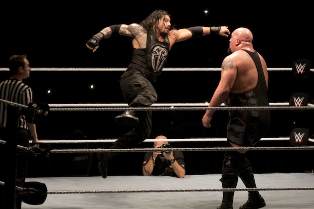 WWE wrestler Roman Reigns, center, fights against Big Show during WWE Live India Tour, in New Delhi, Friday, Jan. 15, 2016. WWE returned to Indian after a gap of 13 years to entertain their fans. (AP Photo/Manish Swarup)