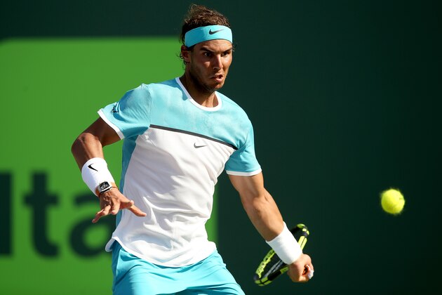 KEY BISCAYNE, FL - MARCH 26:  Rafael Nadal of Spain returns a shot to Damir Dzumhur of Bosnia and Herzegovina during the Miami Open presented by Itau at Crandon Park Tennis Center on March 26, 2016 in Key Biscayne, Florida.  (Photo by Matthew Stockman/Getty Images)