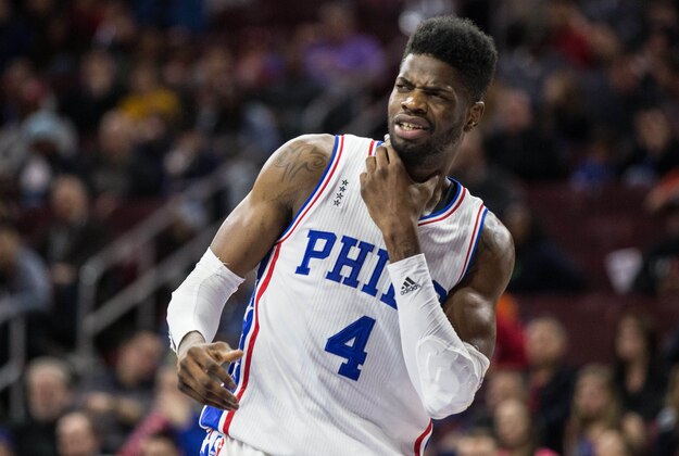 Mar 18, 2016; Philadelphia, PA, USA; Philadelphia 76ers forward Nerlens Noel (4) grabs his neck in reaction to a foul against the Oklahoma City Thunder during the second half at Wells Fargo Center. The Oklahoma City Thunder won 111-97.Mandatory Credit: Bill Streicher-USA TODAY Sports