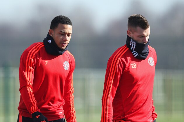 MANCHESTER, ENGLAND - FEBRUARY 24:  (L-R) Anthony Martial, Memphis Depay and Morgan Schneiderlin look on during a Manchester United training session ahead of their UEFA Europa League round of 32 second leg match against FC Midtjylland at the Aon Training Complex on February 24, 2016 in Manchester, United Kingdom.  (Photo by Jan Kruger/Getty Images)