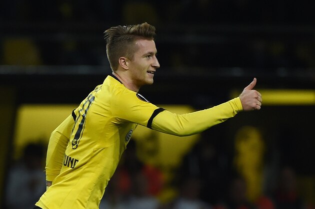 Dortmund's striker Marco Reus celebrates scoring with his teammates during the UEFA Europa League football match Borussia Dortmund vs Qabala FK, in Dortmund, western Germany on November 5, 2015. AFP PHOTO / PATRIK STOLLARZ        (Photo credit should read PATRIK STOLLARZ/AFP/Getty Images)