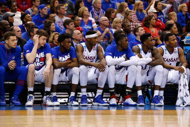 LOUISVILLE, KY - MARCH 26:  Carlton Bragg Jr. #15 of the Kansas Jayhawks (C) and the Kansas Jayhawks bench look on in the first half against the Villanova Wildcats during the 2016 NCAA Men's Basketball Tournament South Regional at KFC YUM! Center on March 26, 2016 in Louisville, Kentucky.  (Photo by Kevin C. Cox/Getty Images)