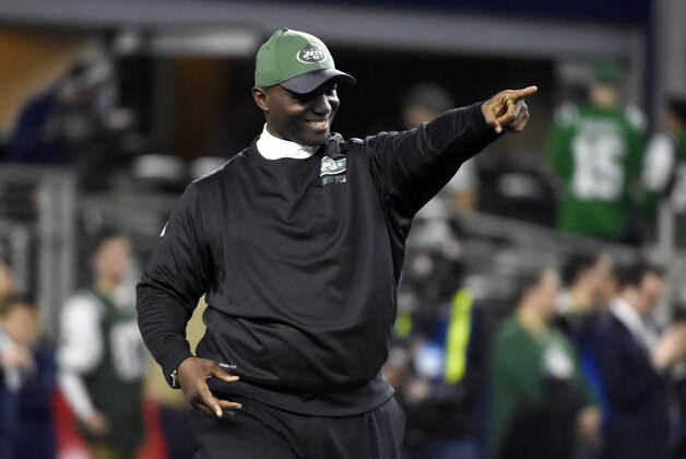 New York Jets coach Todd Bowles points as he stands on the field watching his team warm up before an NFL football game against the Dallas Cowboys on Saturday, Dec. 19, 2015, in Arlington, Texas. (AP Photo/Michael Ainsworth)