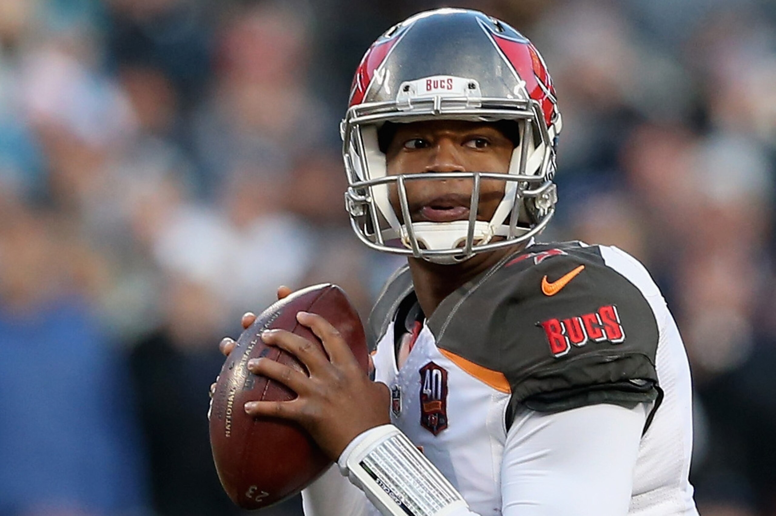CHARLOTTE, NC - JANUARY 03:   Jameis Winston #3 of the Tampa Bay Buccaneers throws a pass against the Carolina Panthers in the 1st quarter during their game at Bank of America Stadium on January 3, 2016 in Charlotte, North Carolina.  (Photo by Streeter Lecka/Getty Images)