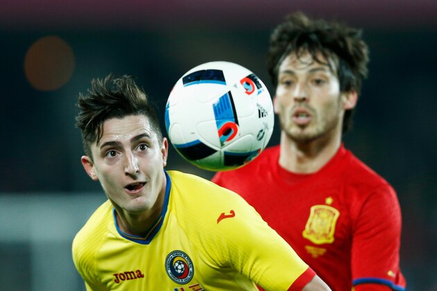 CLUJ-NAPOCA, ROMANIA - MARCH 27:  Steliano Filip of Romania battles for the ball with David Silva of Spain during the International Friendly match between Romania and Spain held at the Cluj Arena on March 27, 2016 in Cluj-Napoca, Romania.  (Photo by Dean Mouhtaropoulos/Getty Images)