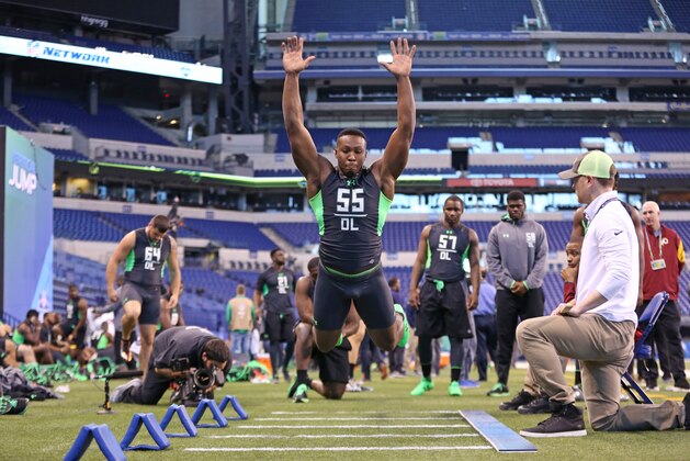 Eastern Kentucky defensive lineman Noah Spence performs a drill at the NFL football scouting combine Sunday, Feb. 28, 2016, in Indianapolis. (AP Photo/Gregory Payan)