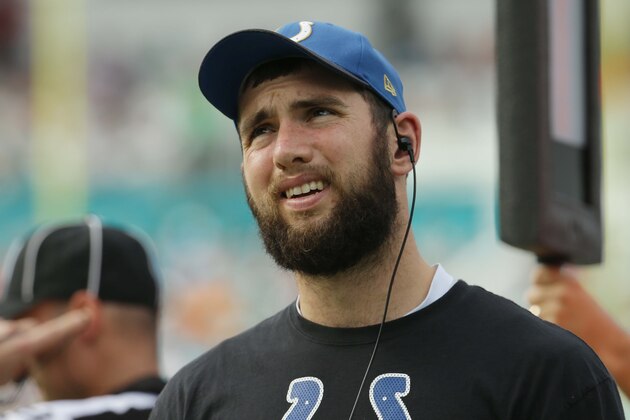 Indianapolis Colts quarterback Andrew Luck looks up from the sidelines during the first half of an NFL football game, Sunday, Dec. 27, 2015, in Miami Gardens, Fla. Luck is not playing due to an injury. (AP Photo/Lynne Sladky)