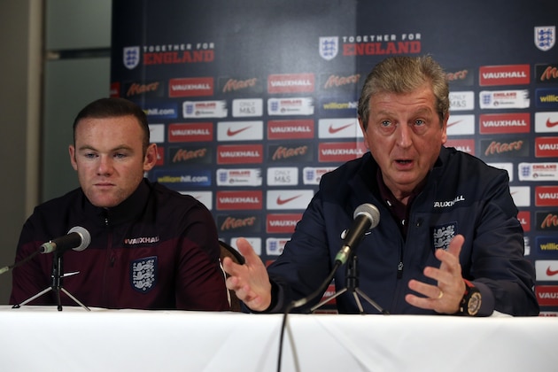 England manager Roy Hodgson (R) and England captain Wayne Rooney (L) give a press conference at a hotel near Watford, north of London, on November 16, 2015, ahead of their international friendly football match against France at Wembley Stadium on November 17. AFP PHOTO / JUSTIN TALLIS

NOT FOR MARKETING OR ADVERTISING USE / RESTRICTED TO EDITORIAL USE        (Photo credit should read JUSTIN TALLIS/AFP/Getty Images)