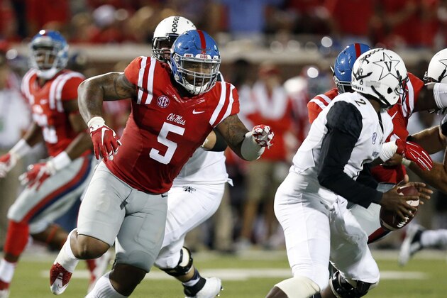 Mississippi defensive tackle Robert Nkemdiche (5) pursues Vanderbilt quarterback Johnny McCrary (2) during the first half of an NCAA college football game Saturday, Sept. 26, 2015, in Oxford, Miss. (AP Photo/Rogelio V. Solis)