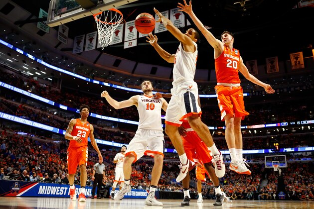 CHICAGO, IL - MARCH 27:  Malcolm Brogdon #15 of the Virginia Cavaliers goes up against Tyler Lydon #20 of the Syracuse Orange in the first half during the 2016 NCAA Men's Basketball Tournament Midwest Regional Final at United Center on March 27, 2016 in Chicago, Illinois.  (Photo by Jamie Squire/Getty Images)