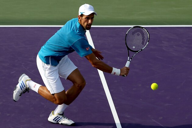 KEY BISCAYNE, FL - MARCH 27: Novak Djokovic of Serbia returns a shot to Joao Sousa of Portugal during the Miami Open presented by Itau at Crandon Park Tennis Center on March 27, 2016 in Key Biscayne, Florida. (Photo by Matthew Stockman/Getty Images)