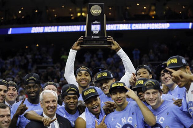 North Carolina celebrates after winning a regional final men's college basketball game against Notre Dame in the NCAA Tournament, Sunday, March 27, 2016, in Philadelphia. North Carolina won 88-74 to advance to the Final Four. (AP Photo/Chris Szagola)