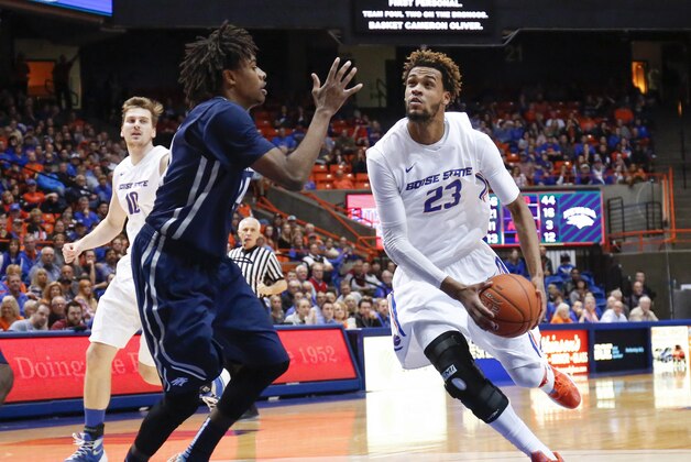 Boise State's James Webb III (23) looks to the basket past Nevada's Lindsey Drew during the second half of an NCAA college basketball game in Boise, Idaho, on Wednesday, March 2, 2016. Boise State won 76-57. (AP Photo/Otto Kitsinger)