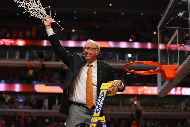 Mar 27, 2016; Chicago, IL, USA; Syracuse Orange head coach Jim Boeheim waves to the crowd after cutting down the net after defeating the Virginia Cavaliers in the championship game of the midwest regional of the NCAA Tournament at the United Center. Mandatory Credit: Dennis Wierzbicki-USA TODAY Sports