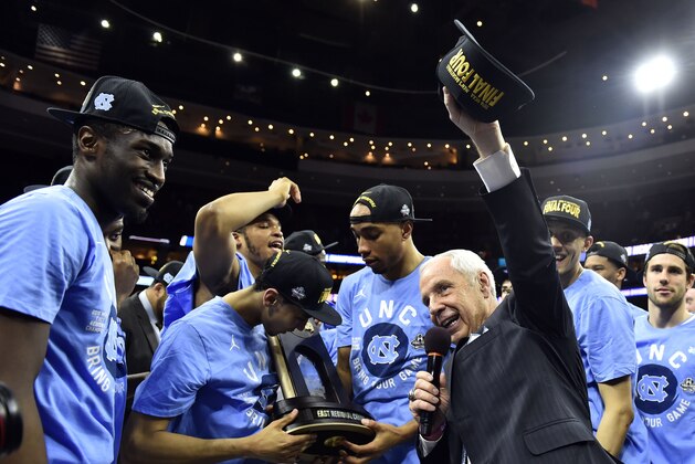 Mar 27, 2016; Philadelphia, PA, USA; North Carolina Tar Heels head coach Roy Williams celebrates with his team after defeating Notre Dame Fighting Irish in the championship game in the East regional of the NCAA Tournament at Wells Fargo Center. Carolina won 88-74. Mandatory Credit: Bob Donnan-USA TODAY Sports