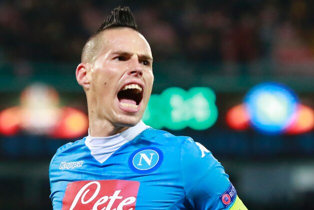 Napoli's Slovak forward Marek Hamsik celebrates after scoring during the UEFA Europa League Round of 32 second leg football match SSC Napoli vs Villareal CF on February 25, 2015 at the San Paolo Stadium in Naples.
 / AFP / CARLO HERMANN        (Photo credit should read CARLO HERMANN/AFP/Getty Images)