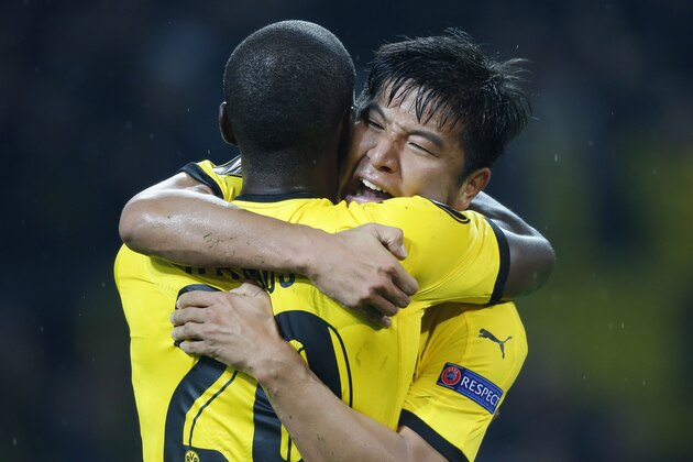 Dortmund's Korean defender Park Joo-Ho (R) celebrates with his teammate Dortmund's Columbian striker Adrian Ramos after scoring the 2-1 during the UEFA Europa League Group C football match between Borussia Dortmund and FC Krasnodar in Dortmund, western Germany, on September 17, 2015. Dortmund won the match 2-1. AFP PHOTO / NORBERT SCHMIDT        (Photo credit should read NORBERT SCHMIDT/AFP/Getty Images)