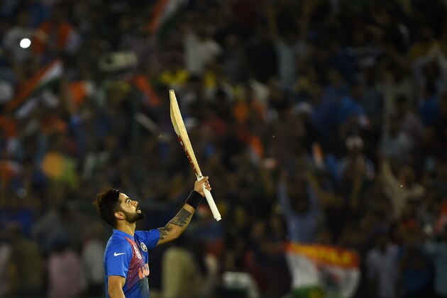 India's Virat Kohli celebrates after victory in the World T20 cricket tournament match between India and Australia at The Punjab Cricket Stadium Association Stadium in Mohali on March 27, 2016. / AFP / MONEY SHARMA        (Photo credit should read MONEY SHARMA/AFP/Getty Images)