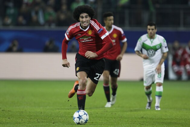 Manchester United's Marouane Fellaini plays the ball during the Champions League group B soccer match between VfL Wolfsburg and Manchester United in Wolfsburg, Germany, Tuesday, Dec. 8, 2015. (AP Photo/Markus Schreiber) Manchester United's Marouane Fellaini plays the ball during the Champions League group B soccer match between VfL Wolfsburg and Manchester United in Wolfsburg, Germany, Tuesday, Dec. 8, 2015. (AP Photo/Markus Schreiber)