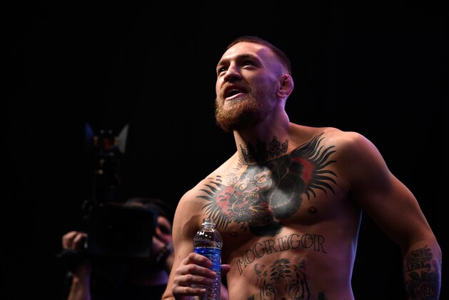 LAS VEGAS, NEVADA - MARCH 04:  Conor McGregor of Ireland stands on stage during the UFC 196 weigh-in at the MGM Grand Garden Arena on March 4, 2016 in Las Vegas, Nevada. (Photo by Jeff Bottari/Zuffa LLC/Zuffa LLC via Getty Images)